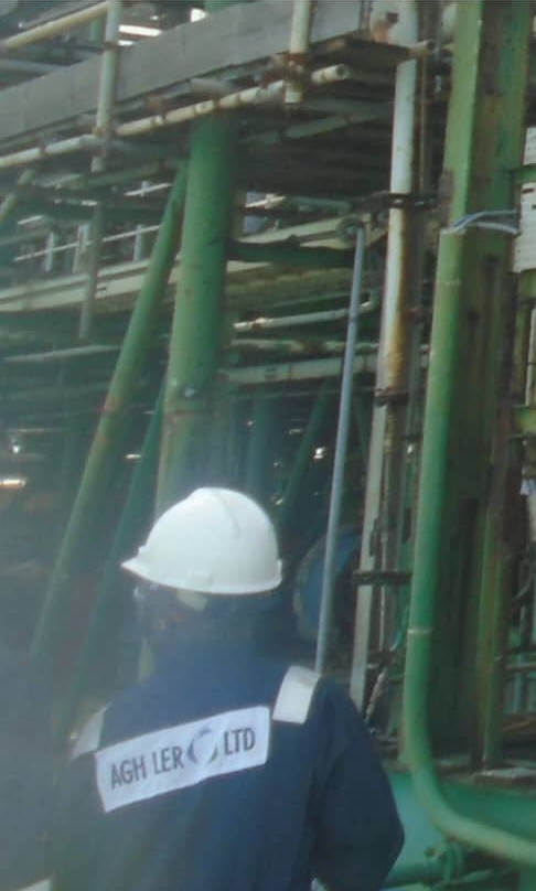 AGH Lero worker in white helmet and branded overalls